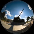 Silhouette of a tank that covers the sun with its muzzle.