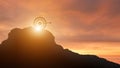 Silhouette target board on the top of the mountain sky sunlight. It is a symbol of leadership successful achievement with goal and Royalty Free Stock Photo