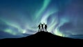 Silhouette of a team at the northen light background.