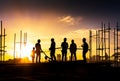 Silhouette of teamwork construction crew, building construction worker working togetherat site Royalty Free Stock Photo