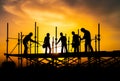 Silhouette of teamwork construction crew, building construction worker working togetherat site Royalty Free Stock Photo