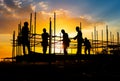 Silhouette of teamwork construction crew, building construction worker working togetherat site Royalty Free Stock Photo
