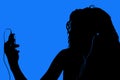 Silhouette of Teen with Digital Video Player