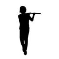 Silhouette teenage boy playing flute.