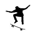 Silhouette teenage boy skateboarder jumping Royalty Free Stock Photo