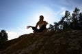 Silhouette Of Teenage Girl Meditating Outdoors