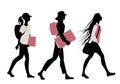 Silhouette of teenage girls going to school