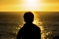 Silhouette of a teenager boy on sunset Royalty Free Stock Photo