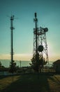 Silhouette of telecommunication tower on sunset