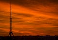 Silhouette of Telecommunications Tower on background of beautiful red sunset or sunrise sky. Kharkiv Television Tower, Ukraine Royalty Free Stock Photo