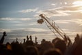 Silhouette of Television Camera hanging on crane is working on outdoor music festival