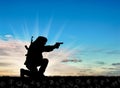 Silhouette of a terrorist with a gun