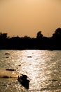 Silhouette of Thai Fishing Boat with sunset Royalty Free Stock Photo