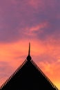 Silhouette Thai style temple roof and sunset