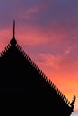 Silhouette Thai style temple roof and sunset