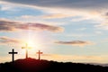 Silhouette three Cross or Crucifixion of Jesus Christian on top of mountain with sunlight and clouds sky. Christianity religion Royalty Free Stock Photo
