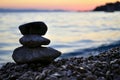 Silhouette of three zen rocks on the beach at sunset Royalty Free Stock Photo