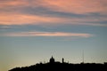 Silhouette of Tibidabo hill at the sunset in Barcelona city. Spain