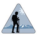 Silhouette of a tourist against the background of snowy mountains
