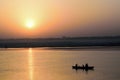 Silhouette tourist boats at Ganges river in Varanasi, India at sunrise