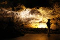 Silhouette of tourist guide in Cueva de los Verdes an amazing volcanic lava tube in Lanzarote, Canary Islands, Spain Royalty Free Stock Photo