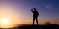 Silhouette of tourist looking far away over sunset Royalty Free Stock Photo