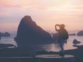 Silhouette tourist taking photograph by mobile phone at sunrise view point Royalty Free Stock Photo
