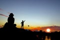 Silhouette tourists watching the sunset on the mountain