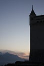 Silhouette of the tower in the sunset. Chillon castle in Montreux city on Geneva lake in Switzerland