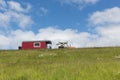 Silhouette of tractor with house trailer against a blue sky Royalty Free Stock Photo