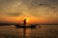 Silhouette of traditional fishermen throwing net fishing inle lake at sunrise time Royalty Free Stock Photo