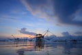 Silhouette traditional fishing method using a bamboo square dip Royalty Free Stock Photo