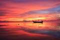 Silhouette traditional longtail boat and beautiful red sky and s