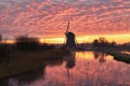 Windmill with intense morning red, De Rietveldse Molen, Hazerswoude Dorp Royalty Free Stock Photo