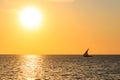 Silhouette of traditional wooden dhow boat in the Indian ocean at sunset in Zanzibar, Tanzania Royalty Free Stock Photo