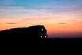 Silhouette of Train Engine Against Prairie Sunset
