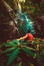 Silhouette traveller man explore waterfall hidden in tropical rainforest jungle Royalty Free Stock Photo