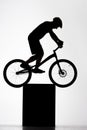 silhouette of trial cyclist balancing on stand