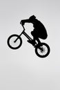 silhouette of trial cyclist jumping on bicycle Royalty Free Stock Photo