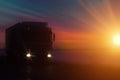 Silhouette Truck with container on highway, cargo transportation concept. Sunset background with copy space