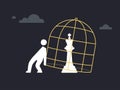 A silhouette is trying to release a king chess piece from the cage Royalty Free Stock Photo