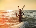 Silhouette of two boy jumping in sea Royalty Free Stock Photo