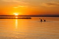 Silhouette of Two Canoeists on Lake during sunset Royalty Free Stock Photo