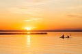 Silhouette of Two Canoeists on Lake during sunset Royalty Free Stock Photo