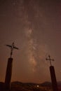 Ocean from the top of the volcanic mountain in FuerteventuraSilhouette of two crosses at night with beautiful milky way background