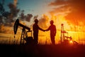 Silhouette of two engineers handshaking in front of oil pump. Generative AI Royalty Free Stock Photo