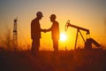 Silhouette of two engineers handshaking in front of oil pump. Generative AI Royalty Free Stock Photo