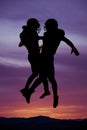 Silhouette of two football players bumping chests Royalty Free Stock Photo