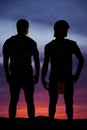 Silhouette of two football players standing Royalty Free Stock Photo