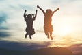 Silhouette of two girl having fun Royalty Free Stock Photo